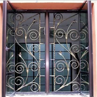 beautiful door designed with aluminum shapes that look like vines growing